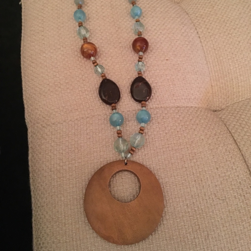 Necklace with wooden disc with beads and stones